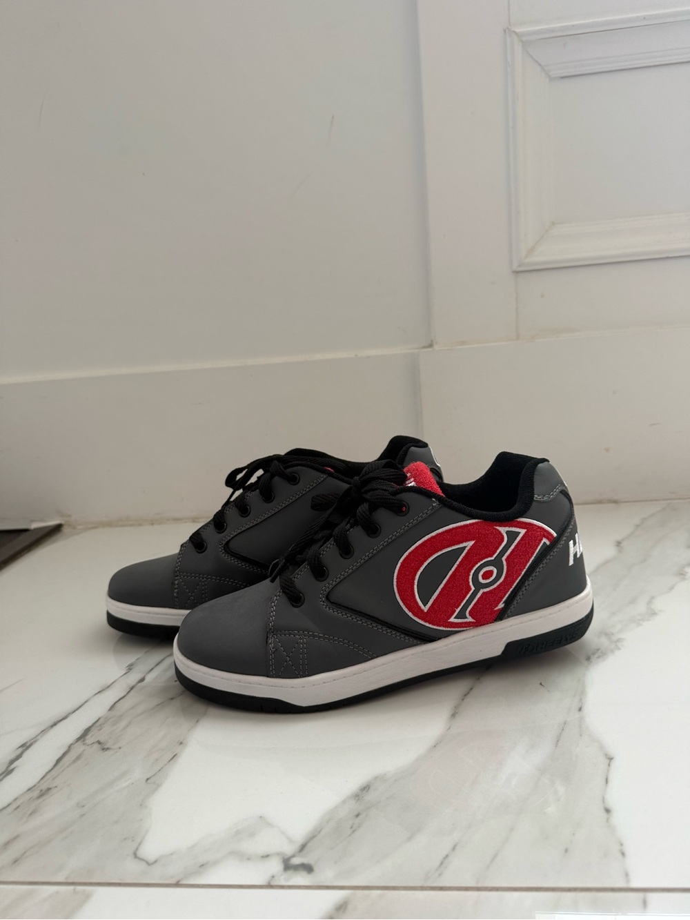 Men’s grey, black, red heelys